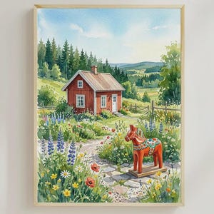 May include: Watercolour painting of a red cottage with a white door and windows, set in a colourful garden. A wooden Dala horse stands on a stone path. The artwork is framed in a light wood frame.