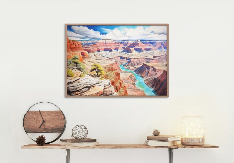 Op de afbeelding: Een ingelijst aquarel schilderij van de Grand Canyon, met een kronkelende rivier door de canyon en een blauwe lucht met witte wolken.