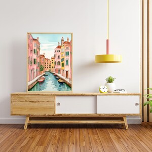 May include: A watercolor painting of a canal in Venice, Italy. The canal is lined with colorful buildings, and there are gondolas floating in the water.
