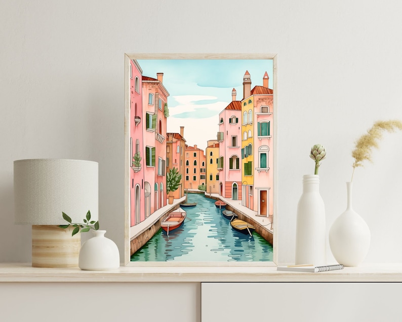 May include: A watercolor painting of a canal in Venice, Italy. The canal is lined with colorful buildings, and there are several gondolas in the water. The painting is framed in a light wood frame.