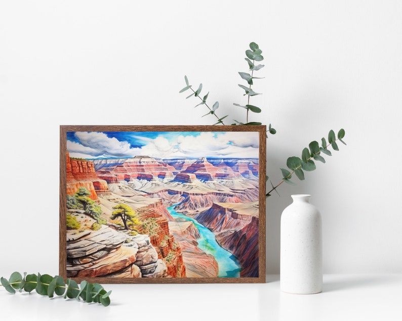 Op de afbeelding: Een ingelijst aquarel schilderij van de Grand Canyon, met een kronkelende rivier en gelaagde rotsformaties in tinten rood, bruin en blauw.