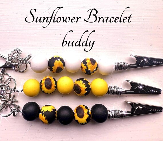 Sunflower atm card clip, long nail helper , bracelet buddy , multiuse tool . Smokers nail protector tool