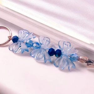 ATM-kaartclip, lange nagelhulp, blauwe strik acryl en kristaldraad verpakt krokodillenklem cadeau voor roker