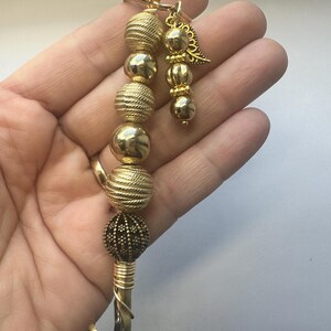 Geldautomaatclip goud, hulparmband, lange spijkerhulp, pinpasgrijper, buddyarmband met blad
