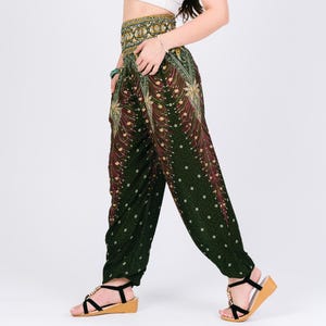 May include: Green, red, and gold patterned pants with a wide waistband. The pants have a peacock feather design.