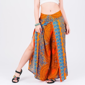 May include: Orange and blue patterned pants with a side slit. The pants have a wide leg and a high waist.