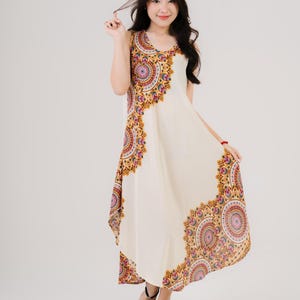 Bright rainbow boho dress with a sleeveless cut. Flowy silhouette, ideal for beach vacations or everyday wear.