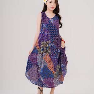 Colorful sleeveless dressed with vibrant stripes, made for summer comfort. Ideal for women seeking bohemian fashion.