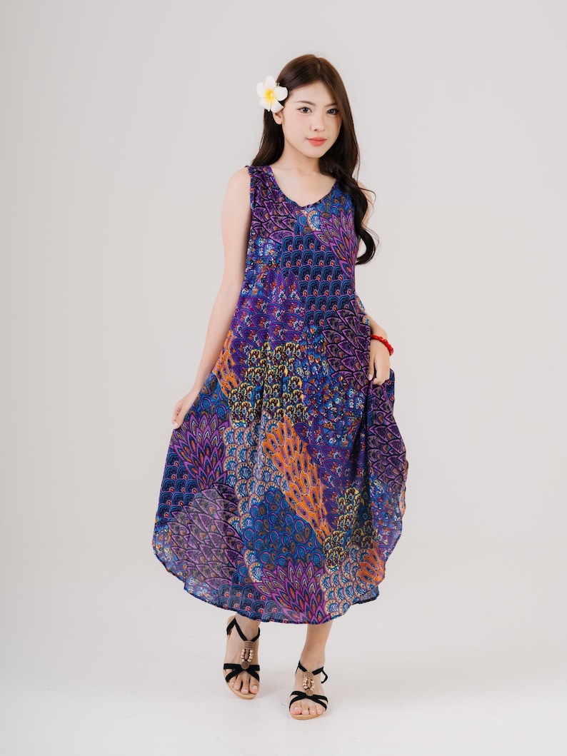 Colorful sleeveless dressed with vibrant stripes, made for summer comfort. Ideal for women seeking bohemian fashion.