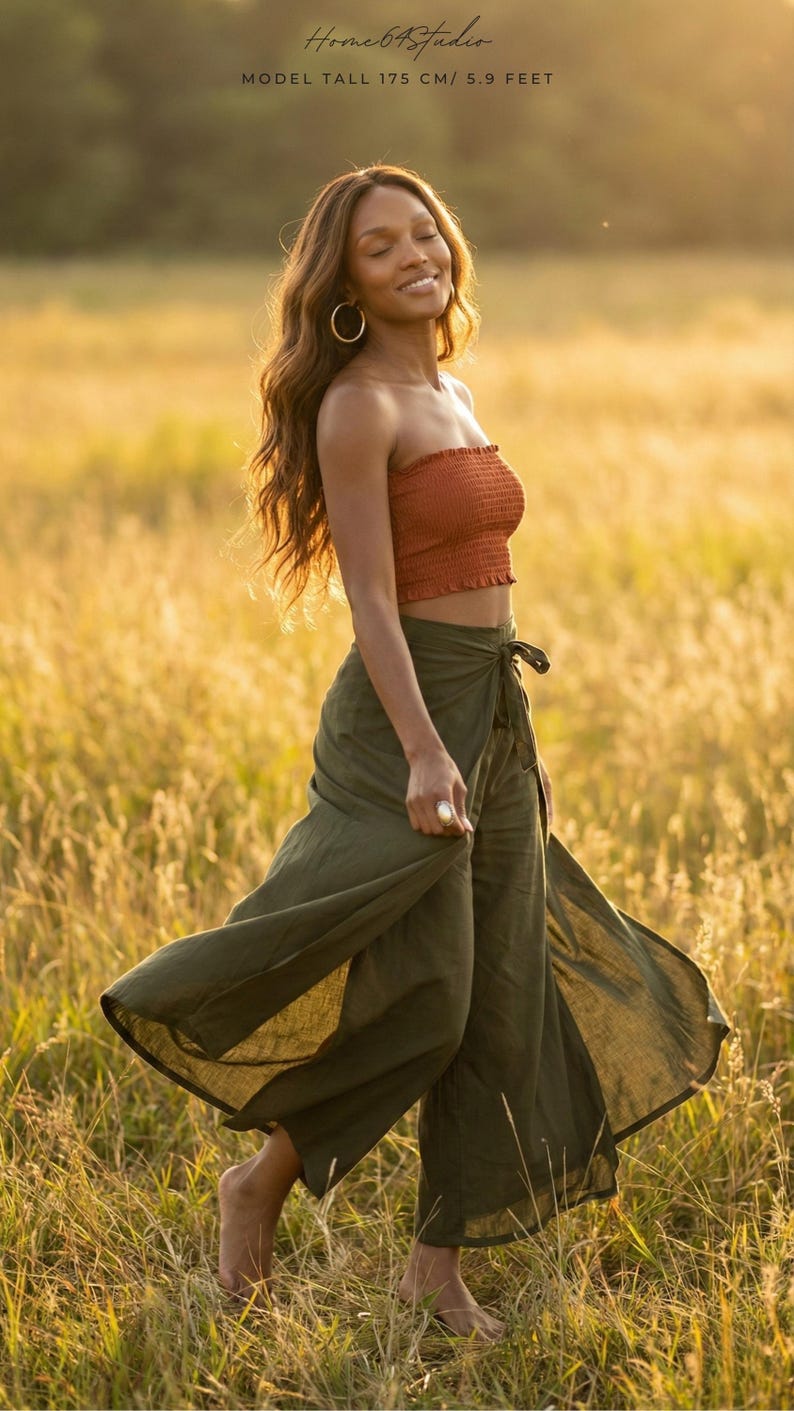 Embrace your free spirit in our Plain Army Green Palazzo Pants! 🌾 Perfect for chasing the golden hour, these breathable boho fit trousers feature a stunning wrap design that flows beautifully in the wind. The dramatic high side slits and airy fabric offer maximum comfort for your summer holidays. In a sunlit field paired with a vibrant orange tube top, these versatile wide-leg pants are made for dancing, festivals, and unforgettable sunset walks. Capture that effortless bohemian vibe! 🌅