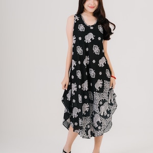 Lightweight sleeveless maxi dress in rainbow tones. Perfect for travel, gifts, or warm-weather styling.