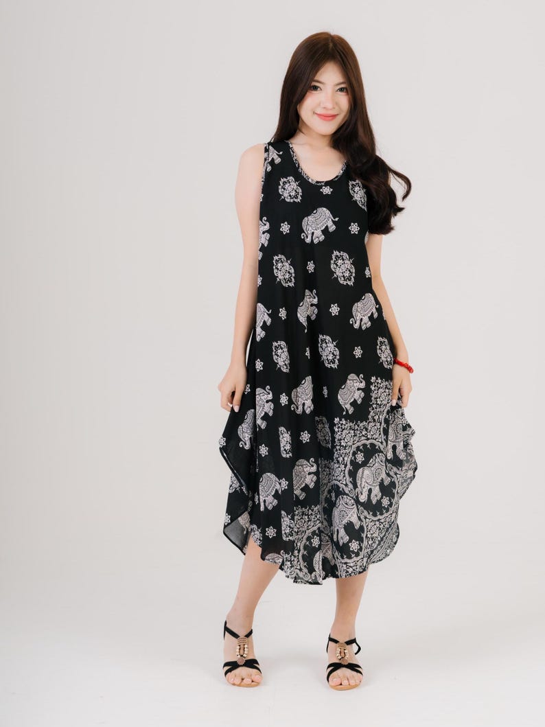 Lightweight sleeveless maxi dress in rainbow tones. Perfect for travel, gifts, or warm-weather styling.