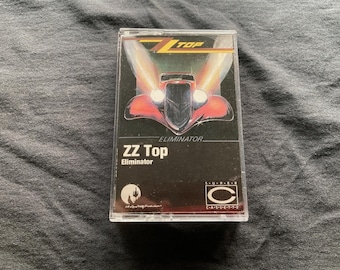 ZZ Top Eliminator Cassette Tape – Classic 80s Rock, “Sharp Dressed Man” “Legs,” Vintage Blues Rock Album, Tested & Working, Retro Music Gift
