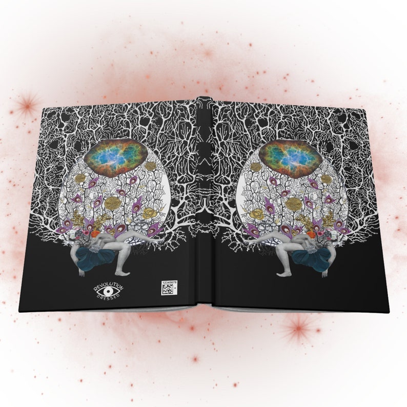 Black hardcover notebook (open flat so that both front and back covers are visible) with collage artwork featuring a figure with a baby, goddess imagery, a drawing of a neuron, floral imagery and a photo of a galaxy and small revolution dressed logo