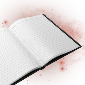 Interior of black notebook with lined pages