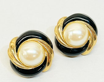 Classic 1990s signed St. John faux pearl clip on statement earrings.