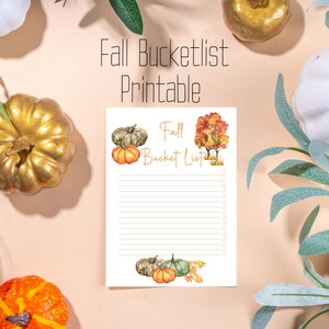 May include: Printable fall bucket list with a watercolor illustration of pumpkins and fall leaves. The text "Fall Bucket List" is at the top of the page.