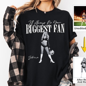 May include: Black graphic t-shirt with the text "I'll Always Be Your Biggest Fan" and the name "Sabrina". The shirt features a black and white image of a woman in a football uniform holding a football.