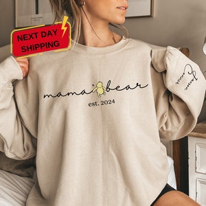 Custom Mama Bear Winnie The Pooh Sweatshirt Mama Est with Kid Name on Sleeve, Personalized Mom Sweatshirt, Gift for Mothers Day
