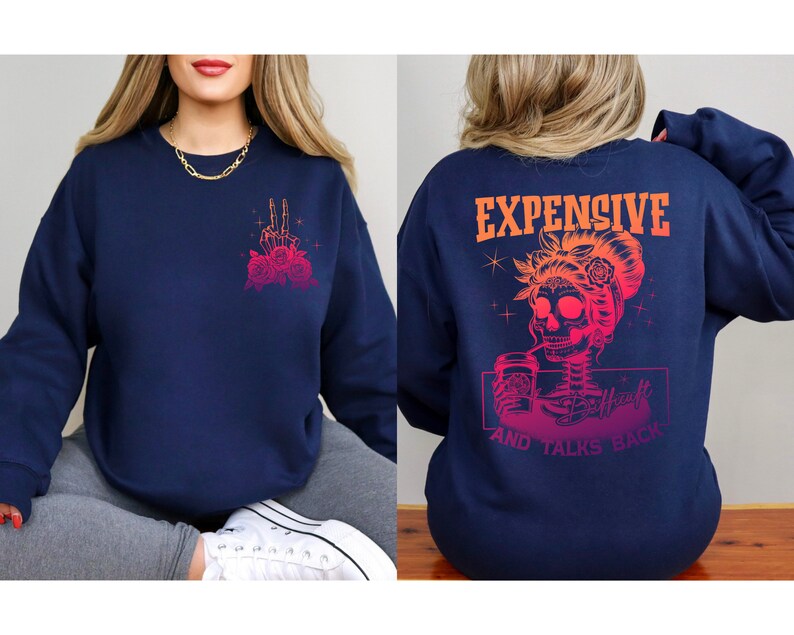 May include: Navy blue sweatshirt with a pink and orange graphic of a skeleton woman drinking coffee with the text "Expensive and Talks Back".