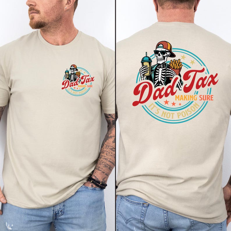 May include: Beige t-shirt featuring a colorful graphic on the front and back. The front graphic is a circular design with the text "Dad Tax" and a skeleton. The back graphic is a larger version of the same design, with the text "Making Sure It's Not Poison".