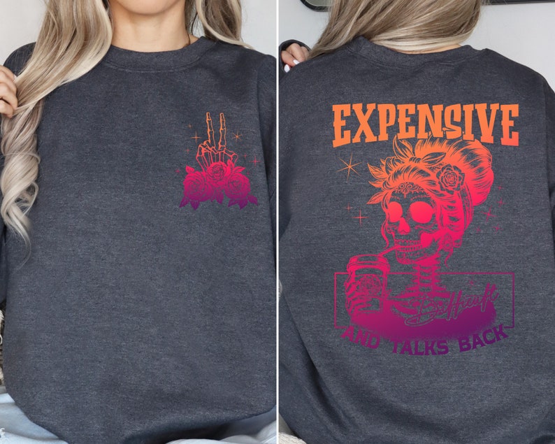 May include: Gray sweatshirt with a skeleton hand with roses on the left side and the text "EXPENSIVE AND TALKS BACK" with a skeleton woman holding a drink on the right side.