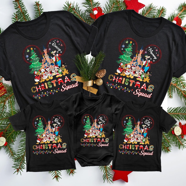 May include: Black t-shirts with a Christmas Mickey Mouse design. The shirts say "Christmas Squad" and have the names "Mommy", "Daddy", "Big", "Little", and "Prince" on them.