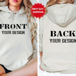 May include: A beige hoodie with the words "FRONT YOUR DESIGN" on the front and "BACK YOUR DESIGN" on the back.