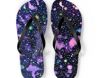 Step into a Celestial Voyage with our Cosmos-Inspired Flip Flops, Adorned in a Palette of Lilac, Pink, Blue, Black, and White.