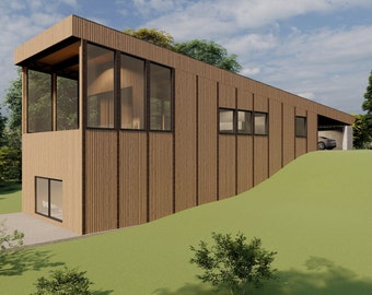 May include: A modern, wood-sided house with large windows and a carport. The house is built on a slope and has a grassy lawn.