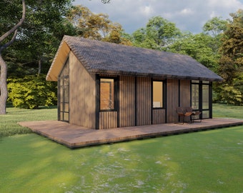 May include: A small, wooden cabin with a gray roof and large windows. The cabin is surrounded by green grass and trees.