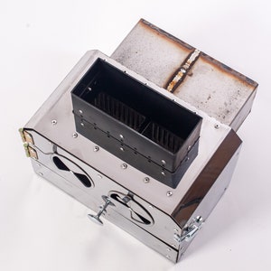 Powerful pellet burner for a stove or heat generator! 50 kW pellet burner with 62 l pellet hopper! Burner in a stove or boiler.