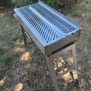 Solid portable grill with side shelf and grill grate! BBQ! Great grill for traveling! Garden grill! Fire pit with grill grate! Barbecue!