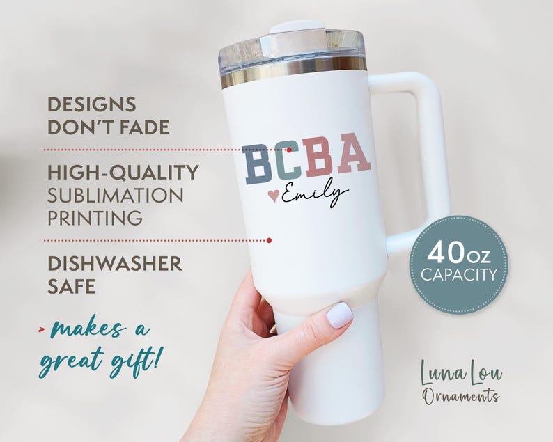 May include: White 40oz capacity tumbler with a handle, featuring the text "BCBA Emily" in blue, green, and pink. The tumbler has a silver lid and is labeled "Dishwasher Safe".