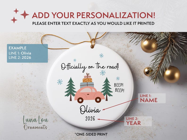May include: A round white ceramic ornament featuring a pink car illustration with stacked gifts on its roof, flanked by two green pine trees. The text reads "Officially on the road!", "BEEP! BEEP!", "Olivia", and "2026". It includes a gold hanging string.