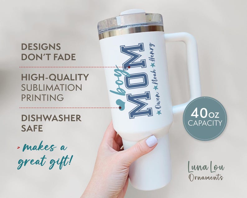 May include: White 40 ounce stainless steel travel mug with a blue and white design that says "boy MOM" and "Owen Noah Henry".