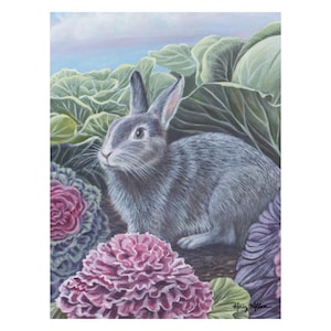 May include: A painting of a gray rabbit amidst green cabbage leaves and vibrant purple and pink ornamental cabbages. The rabbit is facing left, with its ears perked up. The background features a soft blue sky.