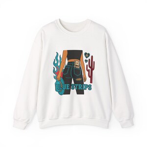 May include: White sweatshirt with a graphic print of a woman wearing blue jeans with a dollar bill in the back pocket. The graphic also includes a cactus, flames, and the text "BLUE STRIPS".