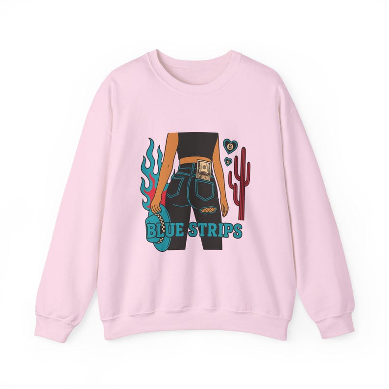 May include: Pink sweatshirt with a graphic of a woman wearing blue jeans with a dollar bill in the back pocket, flames, a cactus, and the text "BLUE STRIPS".