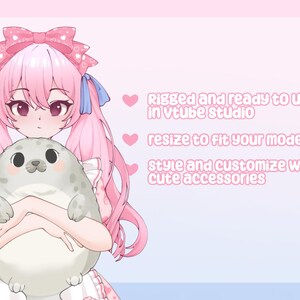May include: An anime-style character with pink hair and a matching bow, holding a gray seal plushie. The image has text that reads: "Rigged and ready to use in VTuber studio, resize to fit your model, style and customize with cute accessories."