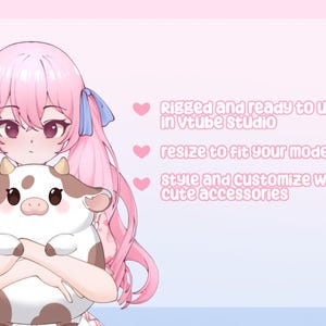 May include: An anime-style illustration of a character with pink hair and blue ribbons, holding a brown and white cow plushie. Text on the right side reads: "Rigged and ready to use in Vtube studio, resize to fit your model, style and customise with cute accessories."