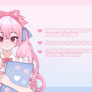 May include: An anime-style illustration of a character with pink hair and a matching outfit, holding a blue tablet with stickers. Text on the right side reads: "Rigged and ready to use in vtube studio, resize to fit your model, style and customize with cute accessories."