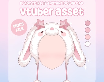 May include: A digital illustration of a white and pink bunny hat with star-shaped accents. The hat has long, fluffy ears and a face cutout. The text "Vtuber asset" is displayed at the top, with "Ready to rig & instant download" above it. A "MOC3 file" label is on the left.
