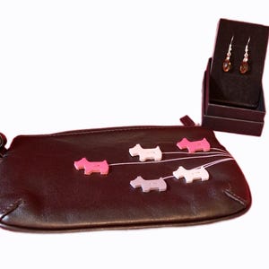 Beautiful 5 Dog Walkies Black Clutch Bag/Purse. Brand new never been used. Comes with Radley dust bag.