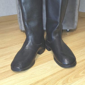 Black leather boots, classic retro style footwear, leather sole, structured shape, height 34 cm