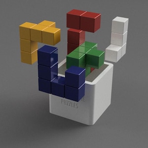 May include: A white box with the word "PUZZLES" printed on it.  The box contains a variety of colorful wooden blocks in the shape of Tetris pieces. The blocks are arranged in a way that resembles a Tetris game.