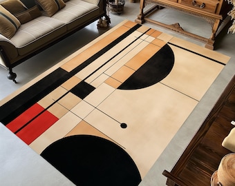 May include: A rectangular area rug featuring a geometric pattern with a beige background, large black semi-circles, thin black lines, and a solid red rectangular block. The design incorporates intersecting lines and shapes across the surface.