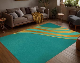 May include: A rectangular area rug featuring a solid teal base color with three prominent, sweeping golden-yellow curved stripes that extend across the upper portion of the rug, creating a distinct wave-like pattern against the flat teal surface.