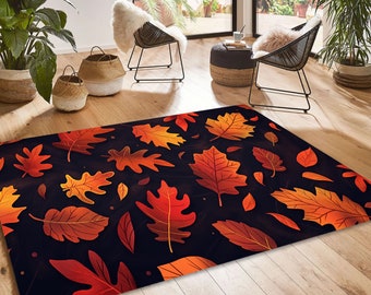 May include: A rectangular area rug featuring a repeating pattern of vibrant autumn leaves in shades of orange, red, and yellow set against a dark, near-black background. The leaves vary in shape and size, creating a dense, scattered foliage design.