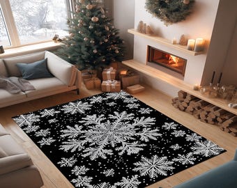 May include: A rectangular area rug featuring a black background with a repeating pattern of white, intricate snowflake designs of varying sizes, covering the entire surface of the floor covering in a symmetrical arrangement.